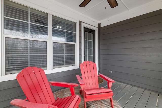 wooden deck featuring a ceiling fan