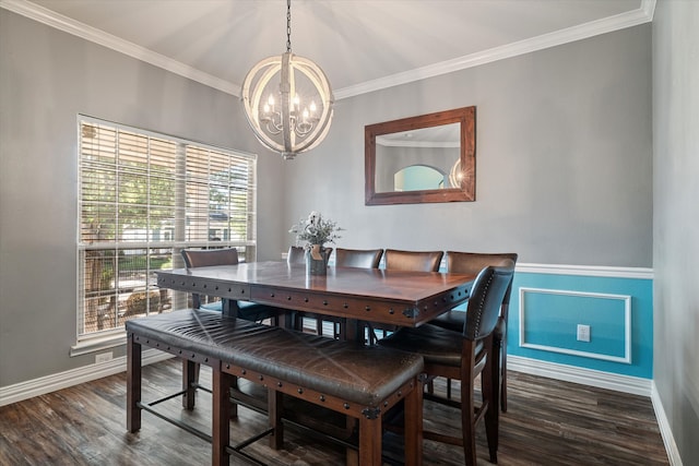 dining room with a chandelier, crown molding, and wood finished floors