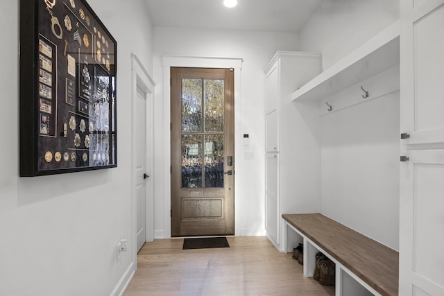 mudroom featuring baseboards and wood finished floors