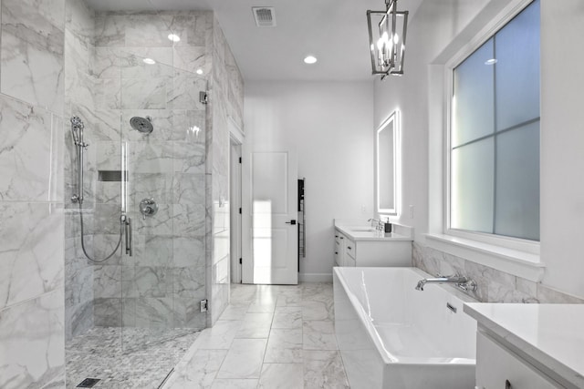 bathroom with a bath, marble finish floor, a shower stall, and visible vents