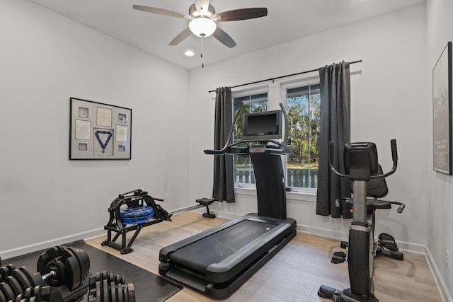 workout room with recessed lighting, ceiling fan, baseboards, and wood finished floors