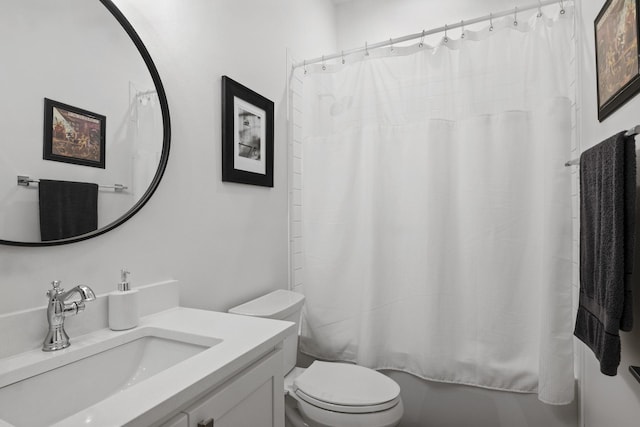 bathroom featuring shower / bath combination with curtain, vanity, and toilet