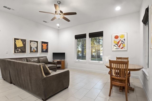 living room featuring ceiling fan, visible vents, baseboards, and recessed lighting