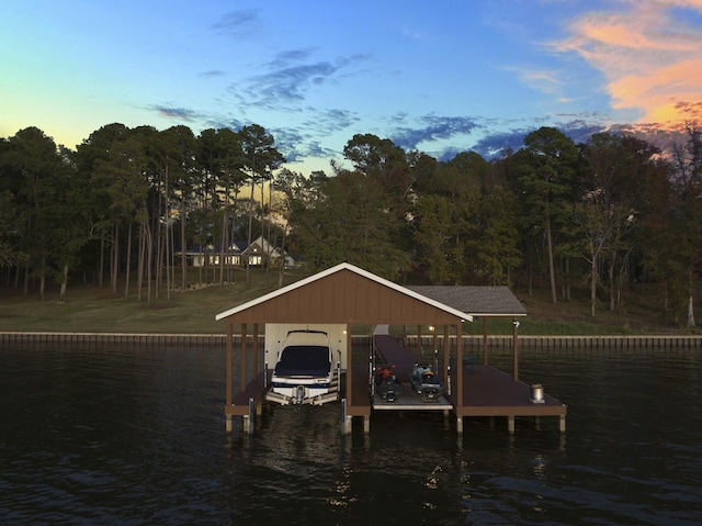 dock area with a water view and boat lift