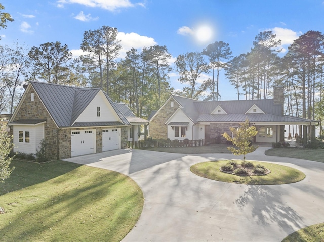 view of front of house featuring stone siding, a standing seam roof, curved driveway, and metal roof