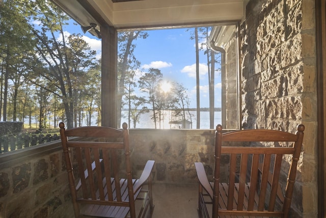 exterior space featuring a water view and a balcony