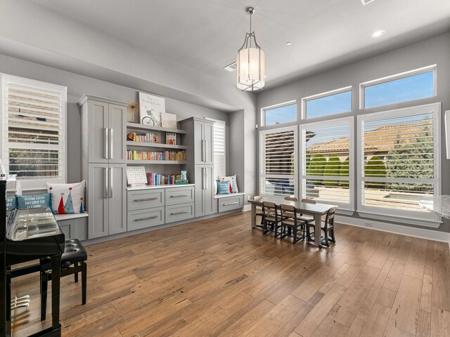 dining room with recessed lighting and light wood-style floors