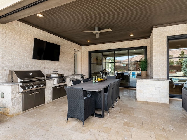 view of patio featuring ceiling fan, area for grilling, outdoor dining area, and grilling area