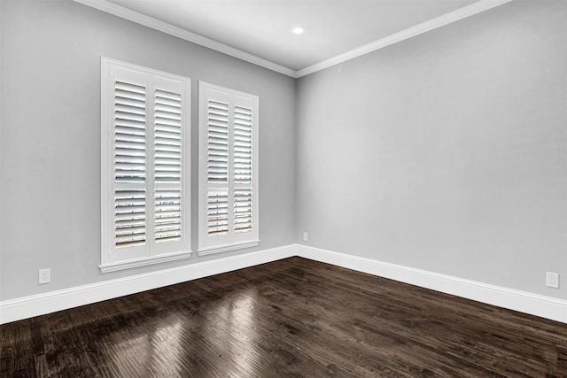 empty room featuring baseboards, dark wood finished floors, crown molding, and recessed lighting