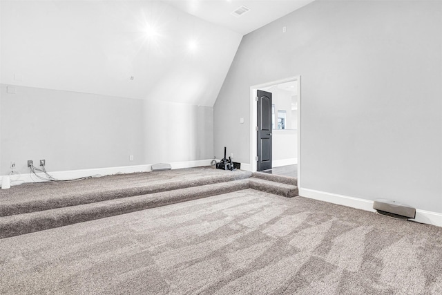 bonus room with lofted ceiling, carpet floors, visible vents, and baseboards