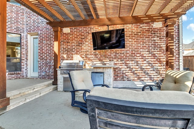 view of patio featuring area for grilling and a pergola