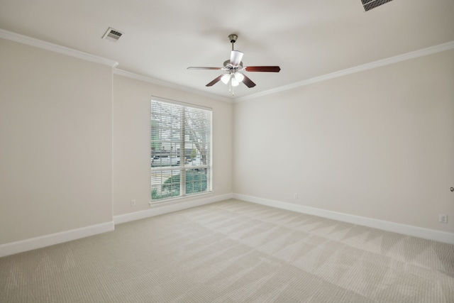 unfurnished room with light carpet, baseboards, visible vents, and ornamental molding