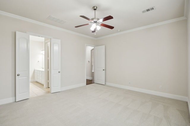 unfurnished bedroom featuring crown molding, visible vents, and light colored carpet