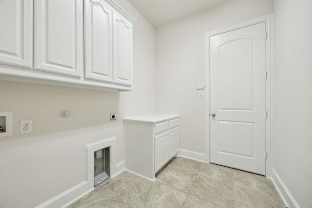 laundry area with washer hookup, cabinet space, electric dryer hookup, and baseboards