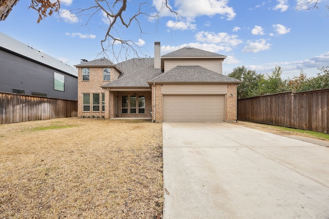 view of front facade with brick siding, a chimney, an attached garage, fence, and driveway