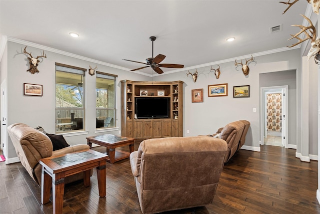 living area featuring ornamental molding, a ceiling fan, and dark wood-type flooring