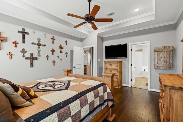 bedroom with visible vents, a raised ceiling, dark wood finished floors, and crown molding