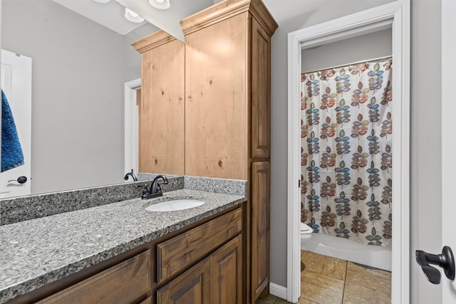 bathroom featuring vanity, tile patterned floors, shower / bath combo, and toilet