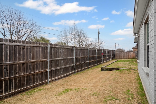 view of yard featuring a fenced backyard