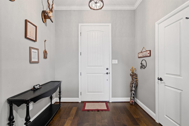 entrance foyer with dark wood-type flooring, crown molding, and baseboards