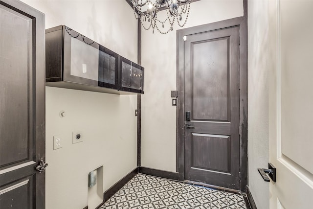 entryway featuring light floors and baseboards