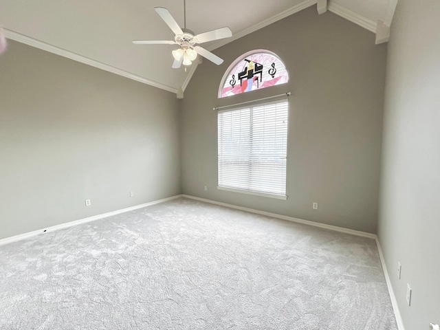 carpeted spare room featuring ornamental molding, high vaulted ceiling, baseboards, and a ceiling fan