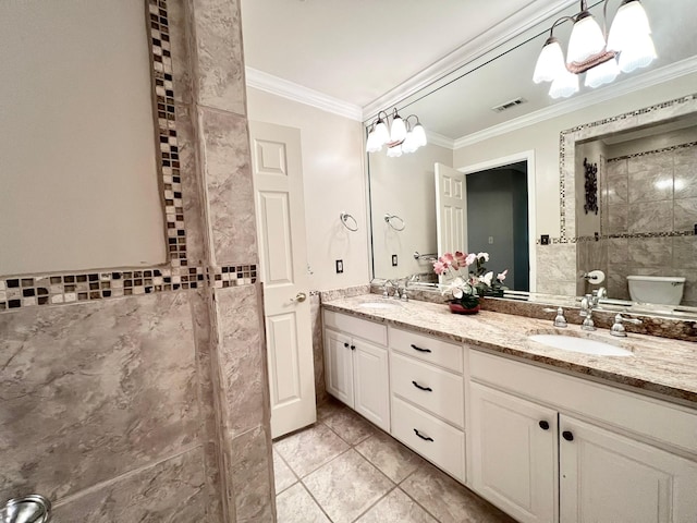 full bath with toilet, a sink, visible vents, ornamental molding, and double vanity