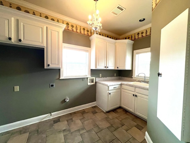 washroom with cabinet space, visible vents, hookup for an electric dryer, washer hookup, and a sink