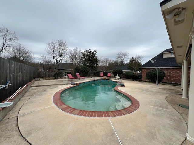 view of pool featuring a patio, a fenced backyard, and a fenced in pool