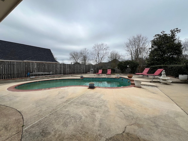 view of swimming pool with a fenced in pool, a patio area, and a fenced backyard