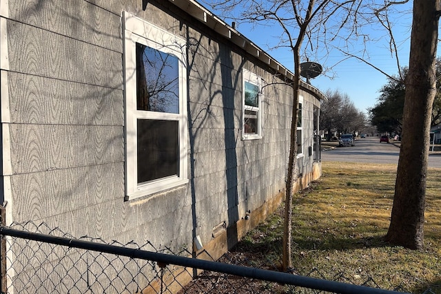 view of property exterior with fence