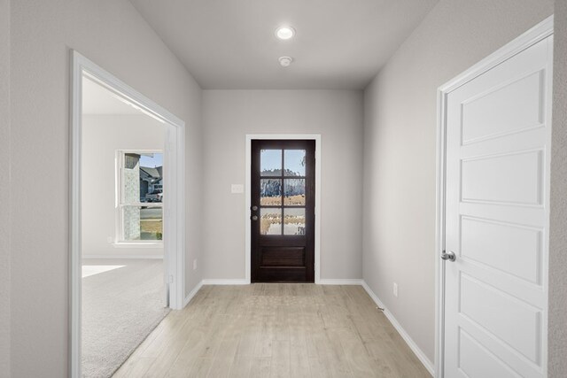 433 Falcon, Azle, TX 76020 - doorway with baseboards and light wood-style flooring