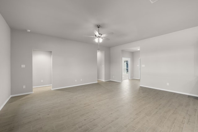 433 Falcon, Azle, TX 76020 - unfurnished living room with light wood finished floors, a ceiling fan, and baseboards