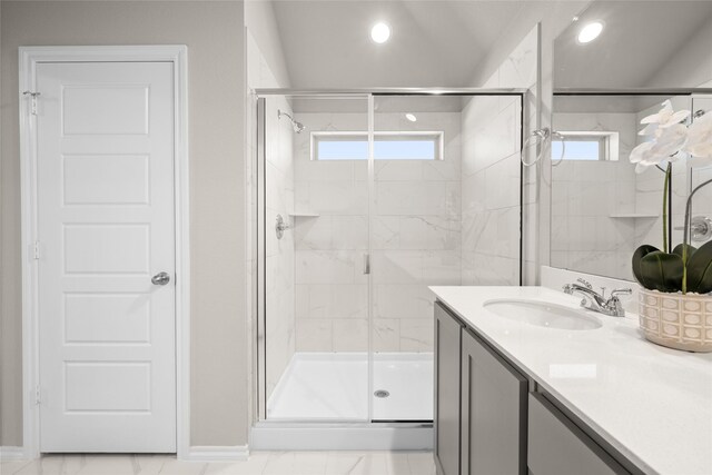 bathroom featuring recessed lighting, marble finish floor, a stall shower, and vanity