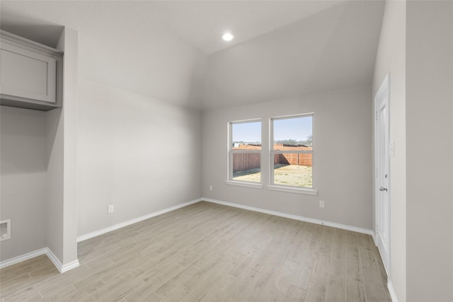 433 Falcon, Azle, TX 76020 - unfurnished bedroom featuring lofted ceiling, light wood finished floors, and baseboards