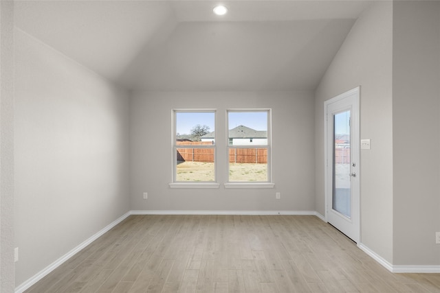 433 Falcon, Azle, TX 76020 - empty room featuring light wood finished floors, vaulted ceiling, and baseboards