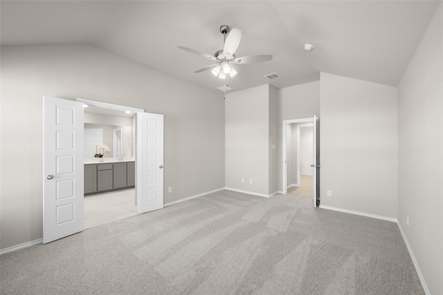 433 Falcon, Azle, TX 76020 - unfurnished bedroom with ensuite bathroom, baseboards, visible vents, light colored carpet, and lofted ceiling