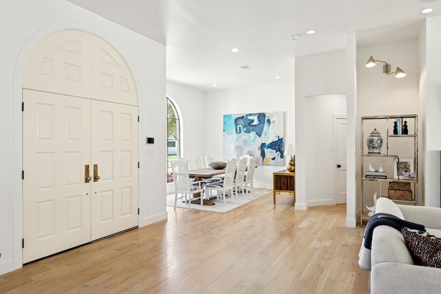 entrance foyer with recessed lighting, baseboards, and light wood-style flooring