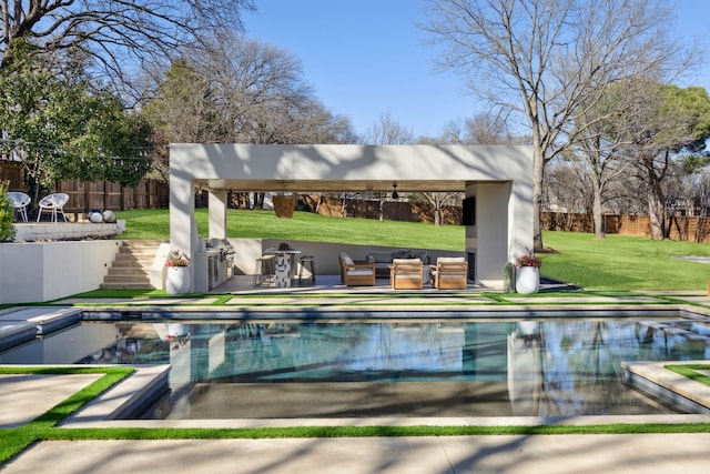 view of swimming pool with a lawn, a fenced in pool, and fence