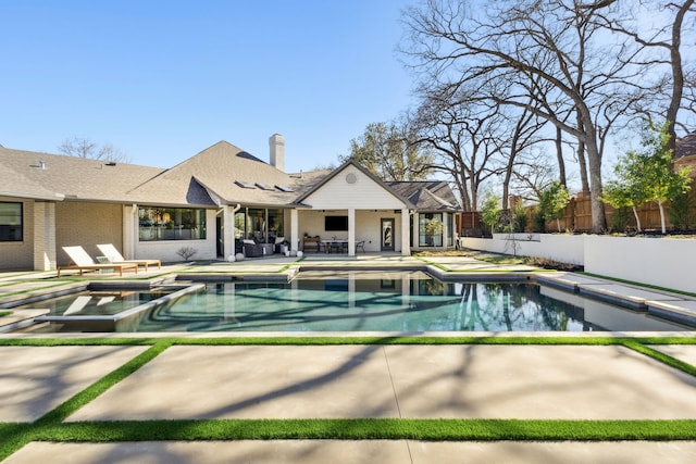 view of pool with a patio area, a fenced in pool, and fence