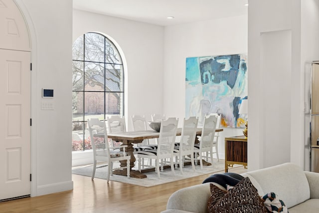 dining room featuring recessed lighting, baseboards, and wood finished floors