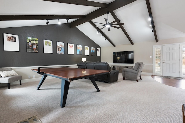 rec room with lofted ceiling with beams, track lighting, a ceiling fan, and carpet flooring