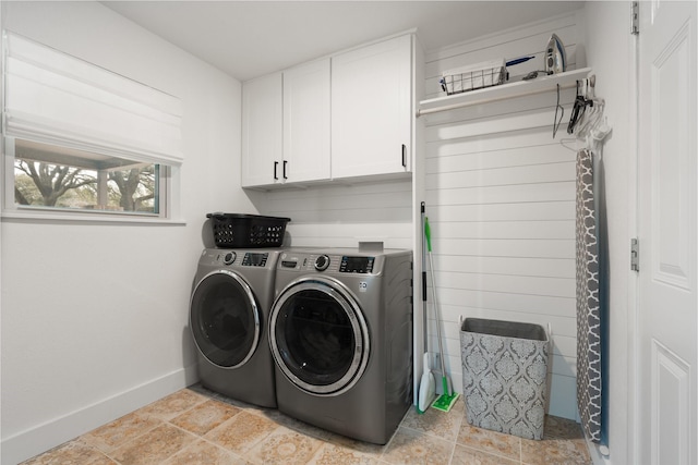 laundry room featuring cabinet space, washer and clothes dryer, and baseboards