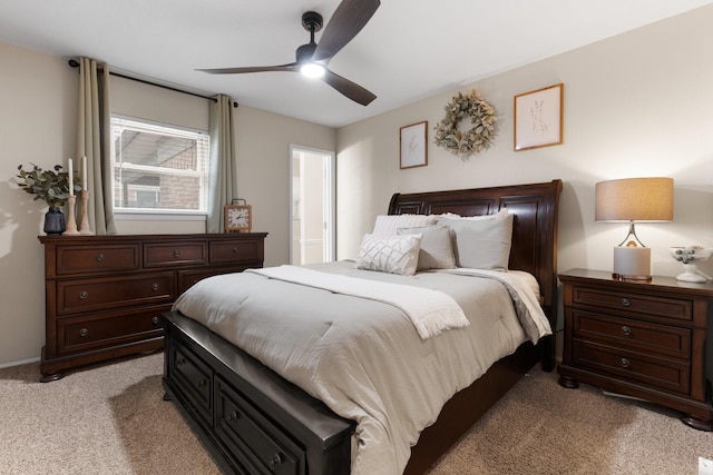 bedroom featuring light colored carpet and ceiling fan