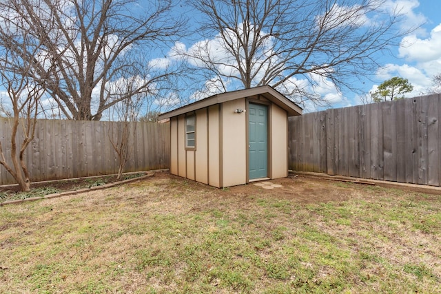 view of shed featuring a fenced backyard