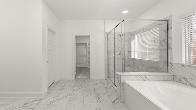 full bathroom with baseboards, a garden tub, marble finish floor, and a marble finish shower