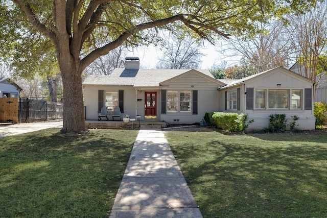 ranch-style home with a shingled roof, fence, crawl space, a chimney, and a front yard