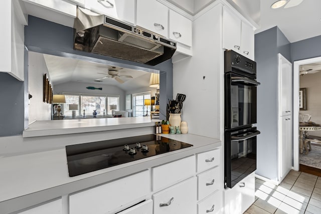 kitchen with light tile patterned floors, a ceiling fan, white cabinetry, light countertops, and black appliances