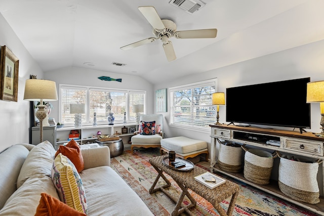 living room featuring visible vents, vaulted ceiling, and a ceiling fan