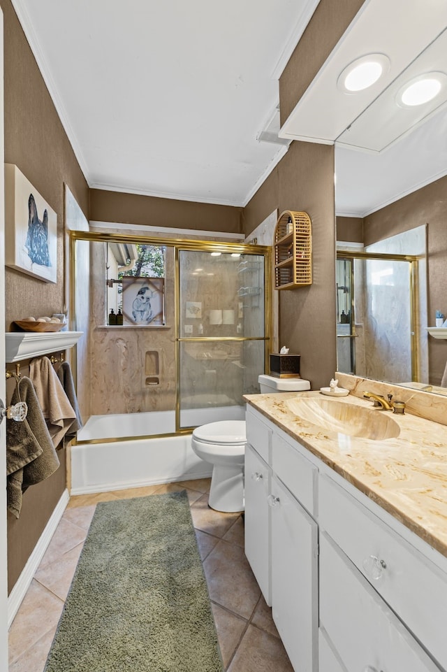 bathroom with shower / bath combination with glass door, vanity, toilet, and tile patterned floors